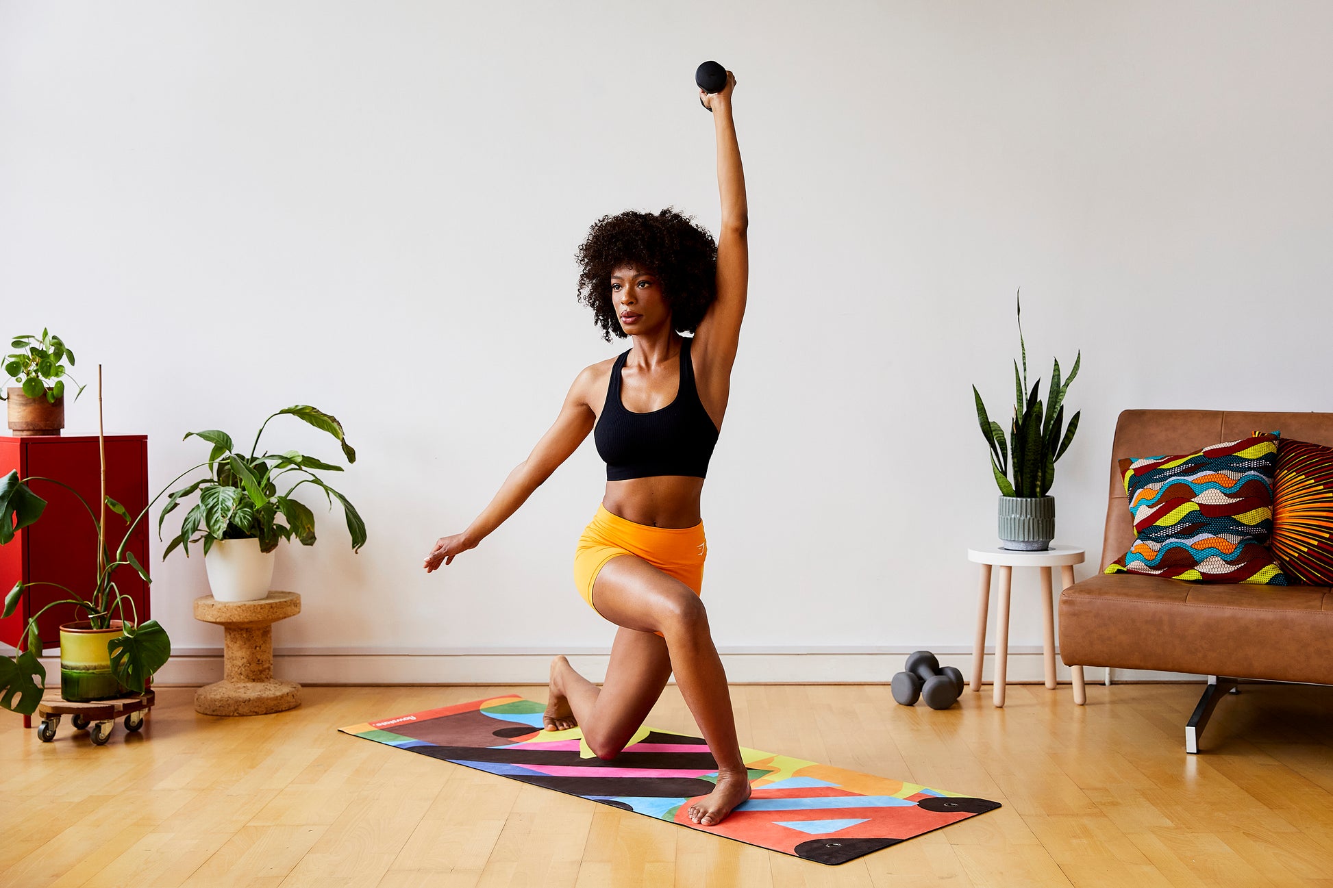 Someone practicing yoga on the Botanical 3 Flowstate Yoga Mat