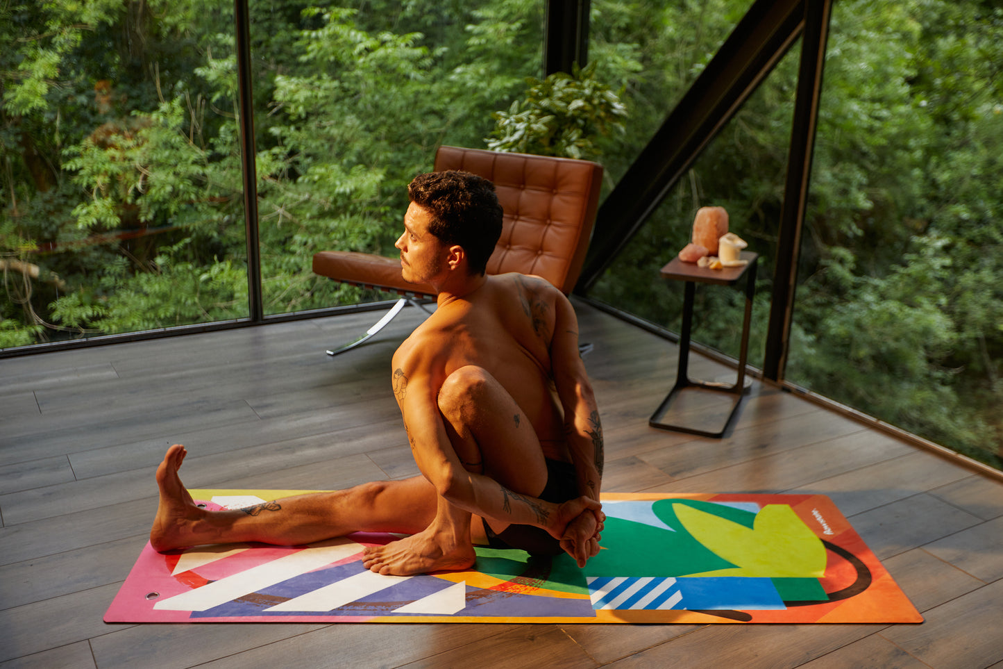 Someone practicing yoga on the Element Collection Surya Flowstate Yoga Mat
