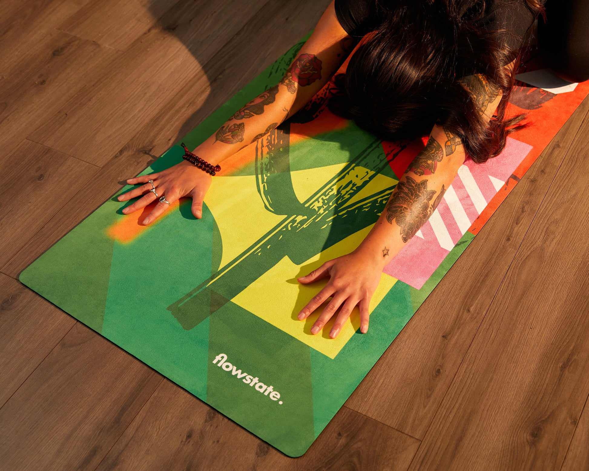Someone practicing yoga on the Element Collection Vana Flowstate Yoga Mat